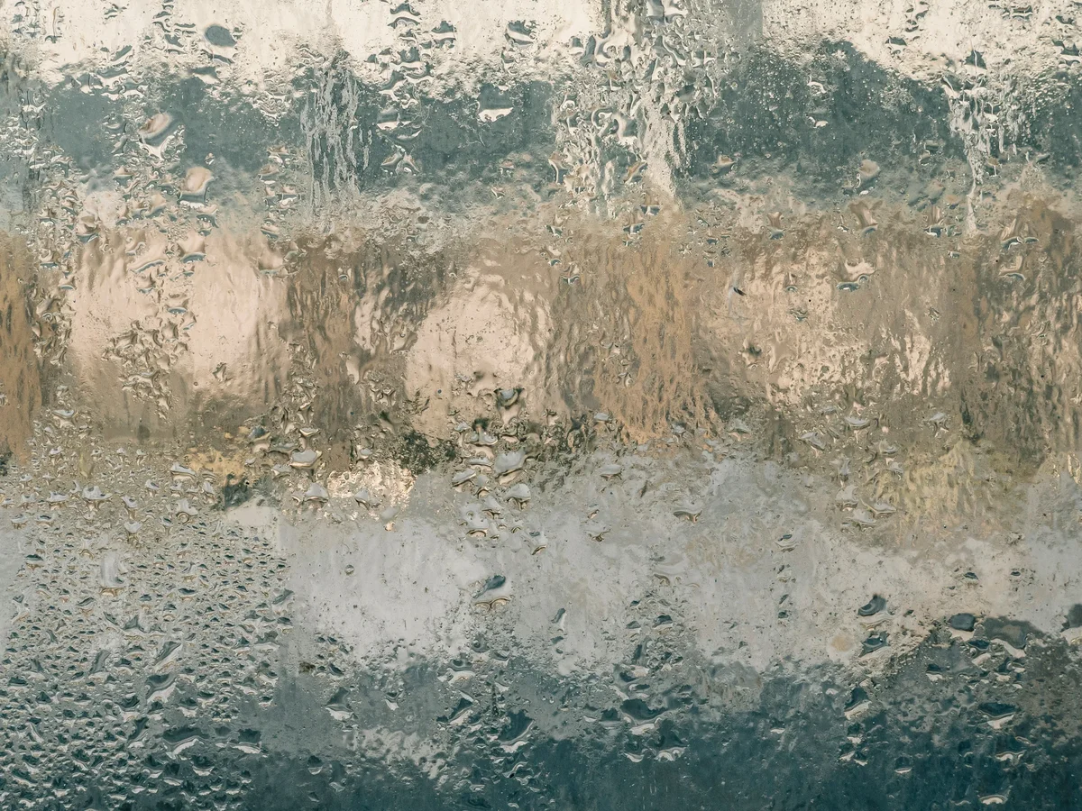 Fogged window due to condensation, illustration of a humidity problem